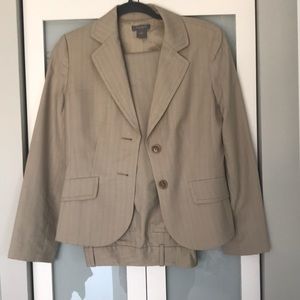 Tan suit, lightly used, great condition.